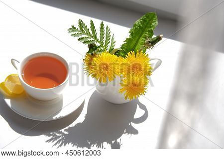 Cup Of Tea, Dandelion Flowers And Phone. Spring Morning.