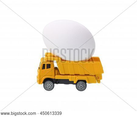 Yellow Egg Truck Isolated On White. White Egg On It
