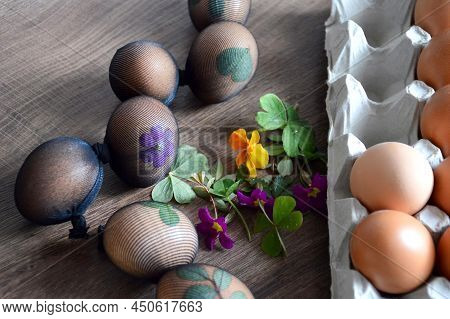 Easter Eggs Decorated With Leaves And Flowers, Prepared For Natural Dyeing With Onion Skins