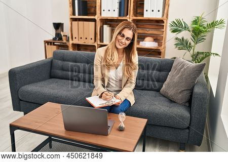 Young blonde woman psychologist having teleconsultation at psychology center