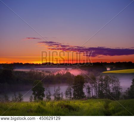A Beautiful Spring Morning In The Northern Europe Rural Area. Seasonal Scenery During Sunrise.