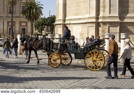 Sevilla, Spain -march 03, 2022 : Horse Drawn Carriages At Plaza De Espana In Seville, Andalusia, Spa