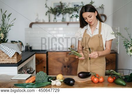Young Woman Cooking In The Kitchen At Home. Healthy Food. Diet. Dieting Concept. Healthy Lifestyle. 