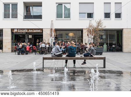 Bitburg, Rhineland-palatinate, Germany - 04 08 2019 - Young Teenage Girls Having A Chat And Eating I