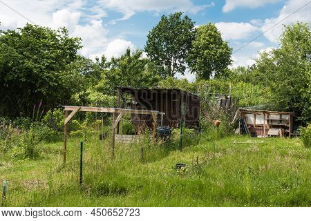 Uccle, Brussels - Belgium -  06  14 2019 - Wooden Garden House And Shed In A Kitchen Garden In The A