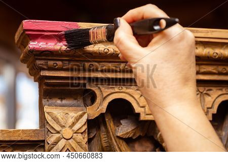 Close-up Of Brush Painting Carved Ornaments On Antique Cupboard For Kitchen Area. Re-usage Of Old Fu