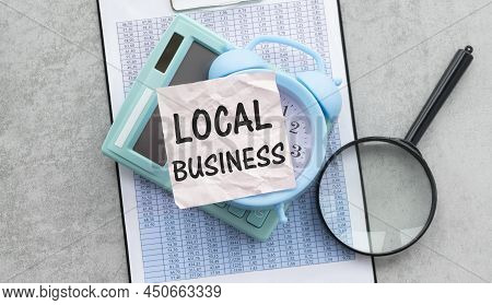 Local Business Concept With Smartphone, Keyboard, Glasses, Keyboard On Gray Table