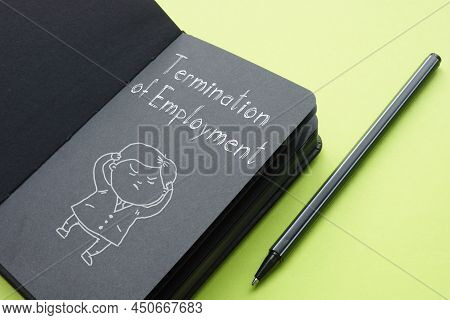 Termination Of Employment Is Shown On A Photo Using The Text