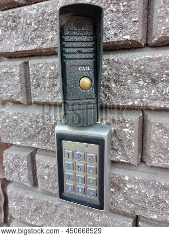 Coded Electronic Lock With Numeric Keypad On A Brick Wall