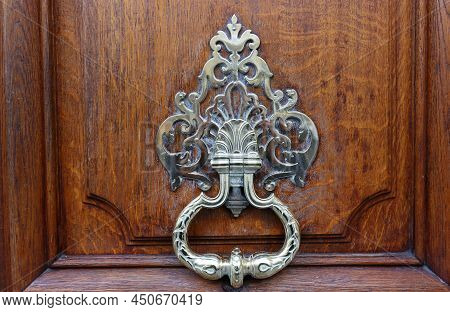 European Vintage Old Metal Wrought Iron Door Knocker. Design Detail. Paris.