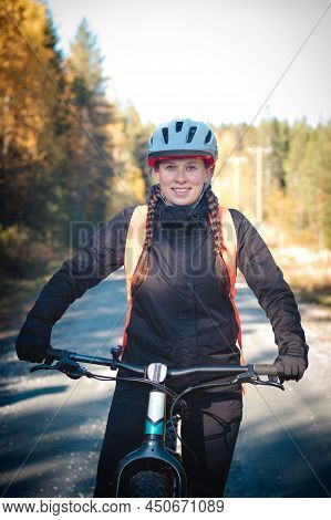 Young Likeable Lady With A Lovely Realistic Smile While Recreationally Sporting. Cyclist Riding Fat 