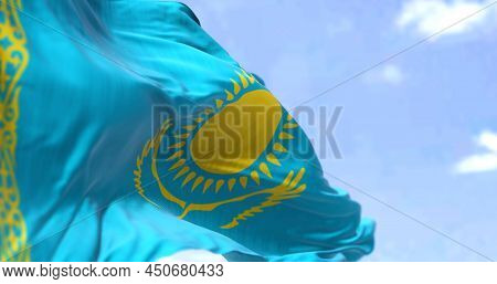 Detail Of The National Flag Of Kazakhstan Waving In The Wind On A Clear Day. Kazakhstan Is A Transco