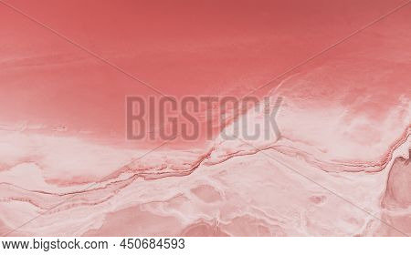 Flying Over A Pink Salt Lake. Salt Production Facilities Saline Evaporation Pond Fields In The Salty