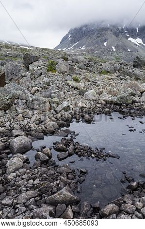 View Of The Area Near The Lake Blavatnet, Rocks And Water, Lyngen Alps, Norway