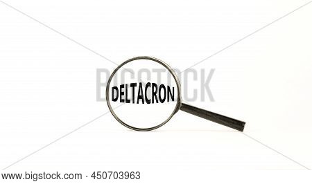 Covid-19 Corona Deltacron Symbol. The Concept Word Deltacron. Magnifying Glass. Beautiful White Tabl