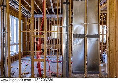 Installing Hot Red Pex Pipe And Air Ventilation And Cleaning System Pipes On The Wall, Amongst Woode