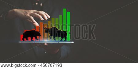 Investment Background, Drawing Of A Bull And A Bear On The Hand Of A Market Maker On A Candlestick C