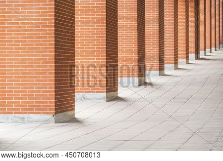 Several Red Brick Columns Stand Next To Each Other In Perspective