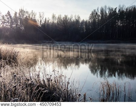 Beautiful Early Winter Morning Scenery Of Landscape Of A Lake With Evaporation Fog In Temperature Be