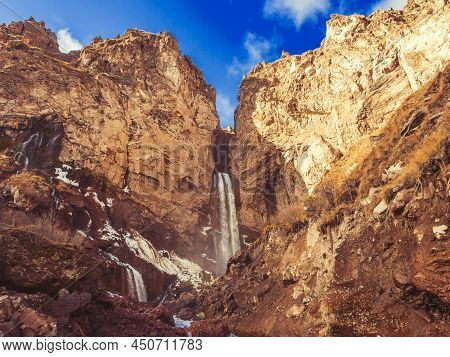Streams Of Water Flow Down Steep Massive Rocks In The Highlands Of The North Caucasus On A Sunny Aut