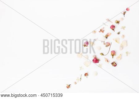 Flowers Composition. Frame Made Of Dried Rose Flowers On White Background. Flat Lay, Top View, Copy 