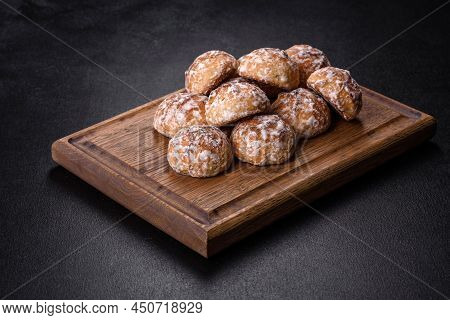 Tasty Homemade Gingerbread Cookies On Dark Concrete Table