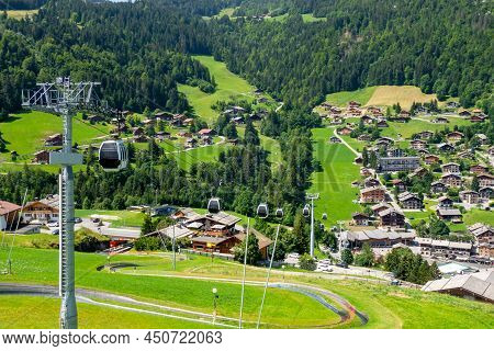 Gondola Above The Village Of La Clusaz In Summer, France