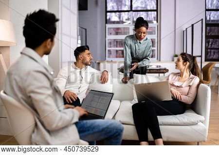 Young Diverse People Working In Coliving Space