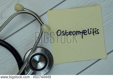 Osteomyelitis Write On Sticky Notes Isolated On Wooden Table. Medical Concept