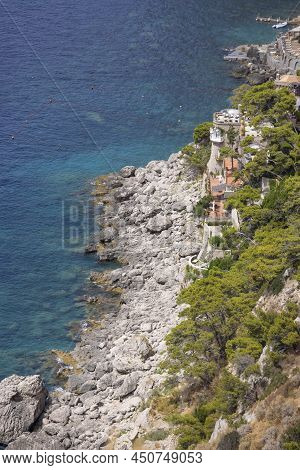 Aerial View Of Rocky Shoreline On The Tyrrhenian Sea Nearby Marina Piccola, Capri Island, Italy