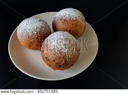 Top View Of A Plate Of Lithuanian Large Cones Against A Dark Background