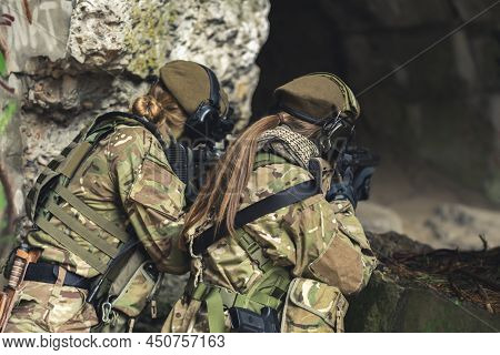Twin Sister Siblings On Guard With Aim Waiting For Threats To Come . High Quality Photo