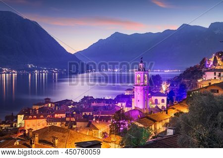 Sala Comacina, Como, Italy small town on Lake Como at dusk.