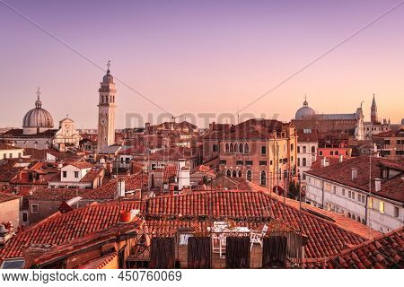 Venice, Italy historic skyline towards San Giorgio dei Greci and other historic landmarks at dusk.