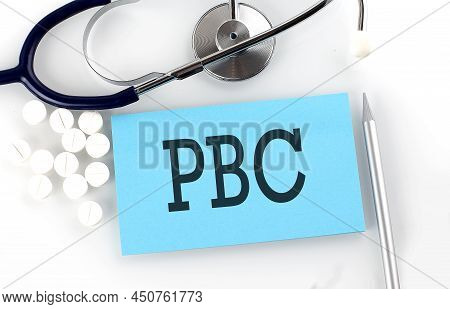 Text Pbc On A Table With Stethoscope,pills And Pen, Medical Concept.