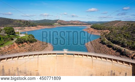 Aerial. Photo From Sky, Dams Filled With Water Bravura Portimao. In Background, A Park Of Wind Gener