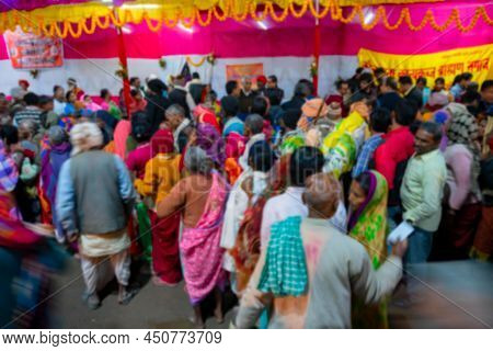 Blurred Image Of Kolkata, West Bengal, India. Hindu Devotees With Families Queing Up For Roti, India