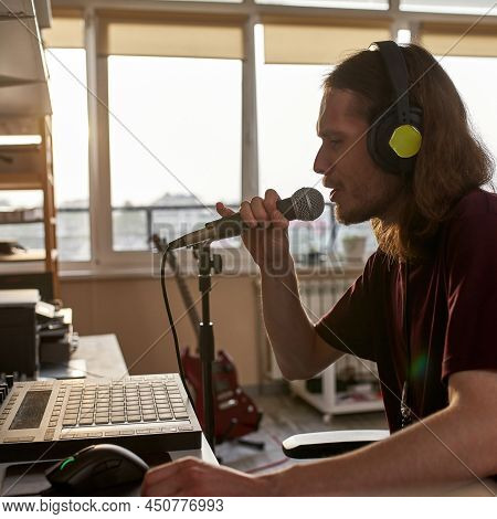 Male Singer Singing Song In Microphone And Recording It At Home Studio. Concept Of Domestic Hobby, E