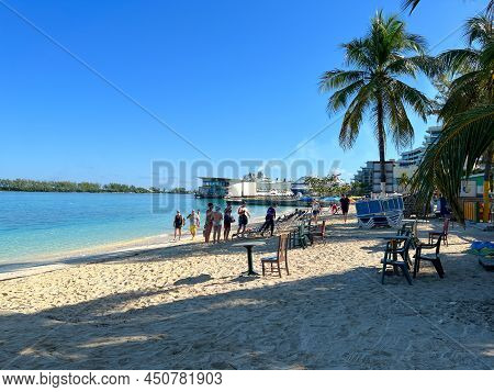 People Enjoying Junkanoo Beach In Nassau, Bahamas.