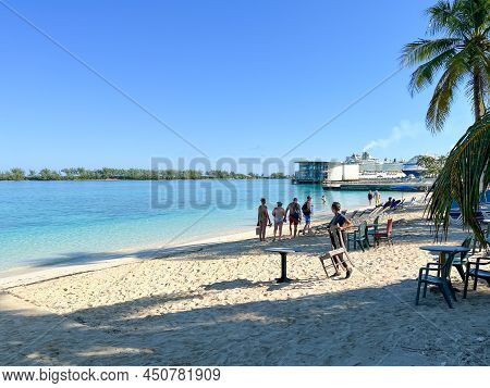 People Enjoying Junkanoo Beach In Nassau, Bahamas.
