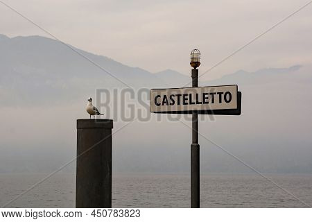 The Ferry Port Sign At Castelletto Di Brenzone On Lake Garda In Verona Province, Veneto, North East 