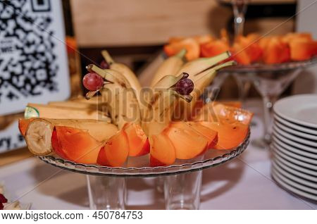 Fruit Slicing At A Wedding Banquet. Watermelon, Grapes, Strawberry, Orange, Plum, Pear, Dinha, Peach
