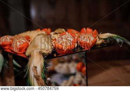Fruit Slicing At A Wedding Banquet. Watermelon, Grapes, Strawberry, Orange, Plum, Pear, Dinha, Peach