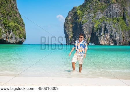 Happy Tourist Man At Maya Bay Beach On Phi Phi Island, Krabi, Thailand. Landmark, Destination Southe