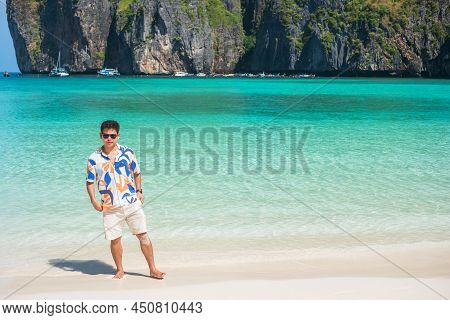 Happy Tourist Man At Maya Bay Beach On Phi Phi Island, Krabi, Thailand. Landmark, Destination Southe
