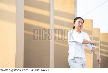 Asian Long Hair, Man In White Long Arm T-shirt Is Standing At The Rooftop Outdoor Field With Light B