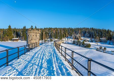 Cerna Nisa, Or Bedrichov, Dam In Sunny Winter Evening. Snowy Landscape Wing Long Sunset Time Shadows