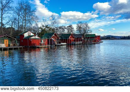 Derito To Lake In Tata Hungary With Cute Colorful Fishing Cabins