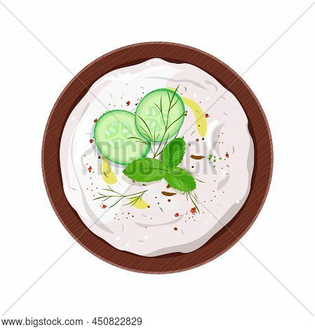 Traditional Indian Raita With Yogurt, Cucumber, Cumin And Mint, Served In A Bowl And Garnished With 