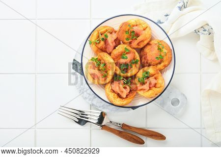 Yorkshire Pudding. Traditional English Yorkshire Pudding With Salmon And Radish Microgreens Side Dis